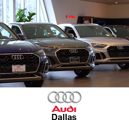 A group of cars are parked in a showroom that has been disinfected with ArrowClean products.