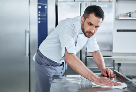 A food counter being cleaned with eco-friendly disinfectants.